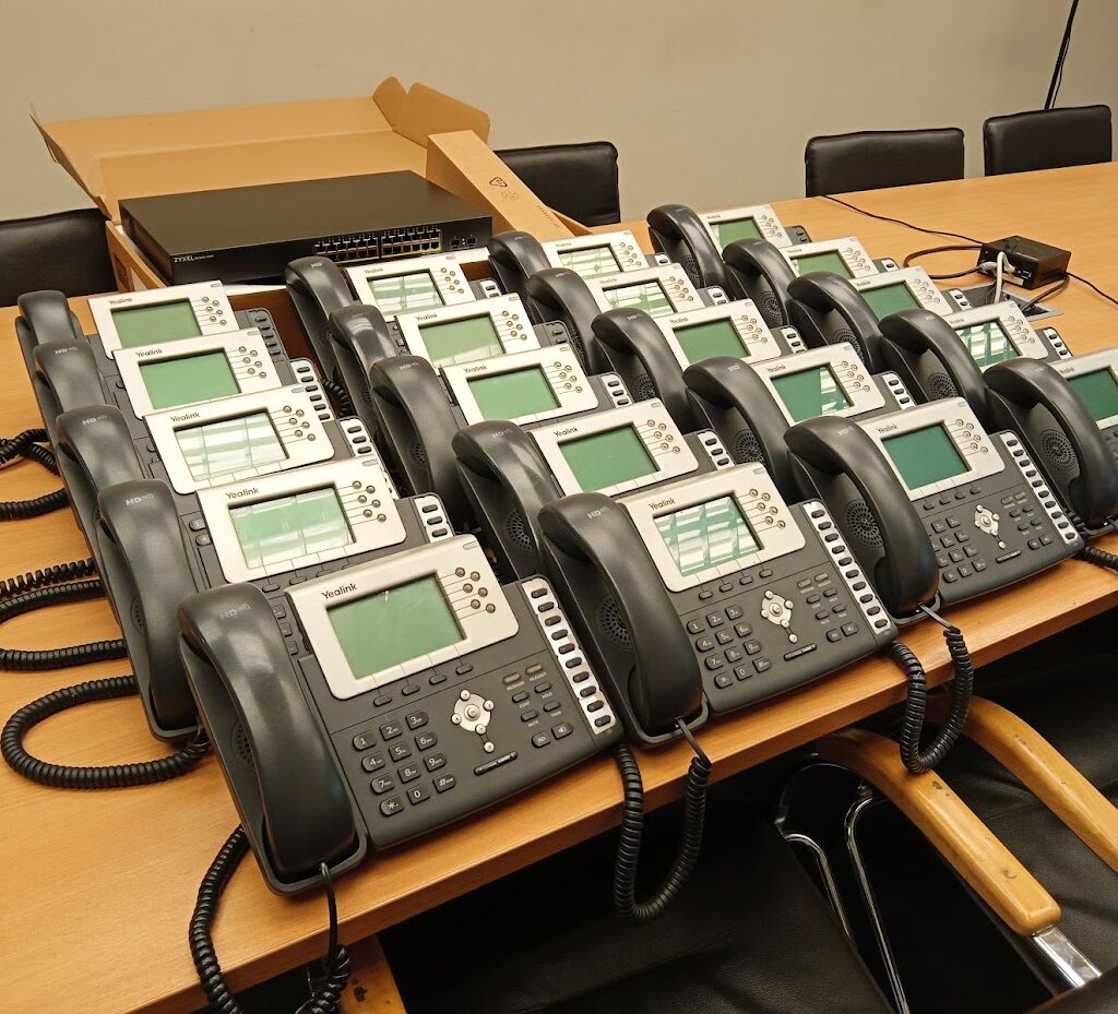 Yealink VOIP phone systems on a desk in Conference Room